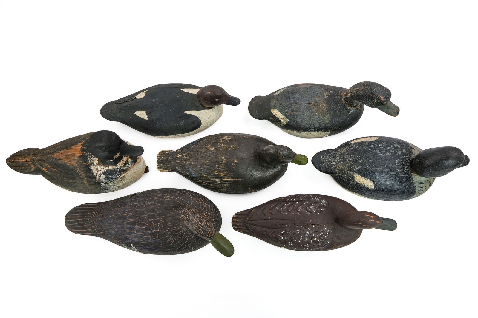 7 Quebec Decoys: A group of 7 Quebec decoys including Felix Foussseau Pincount, PQ drake whistler. Willie Leduc Valleyfield, QB hen goldeneye. Raoul Pilon, Rigaud, QB bluebill drake with hump back and high head. Robin