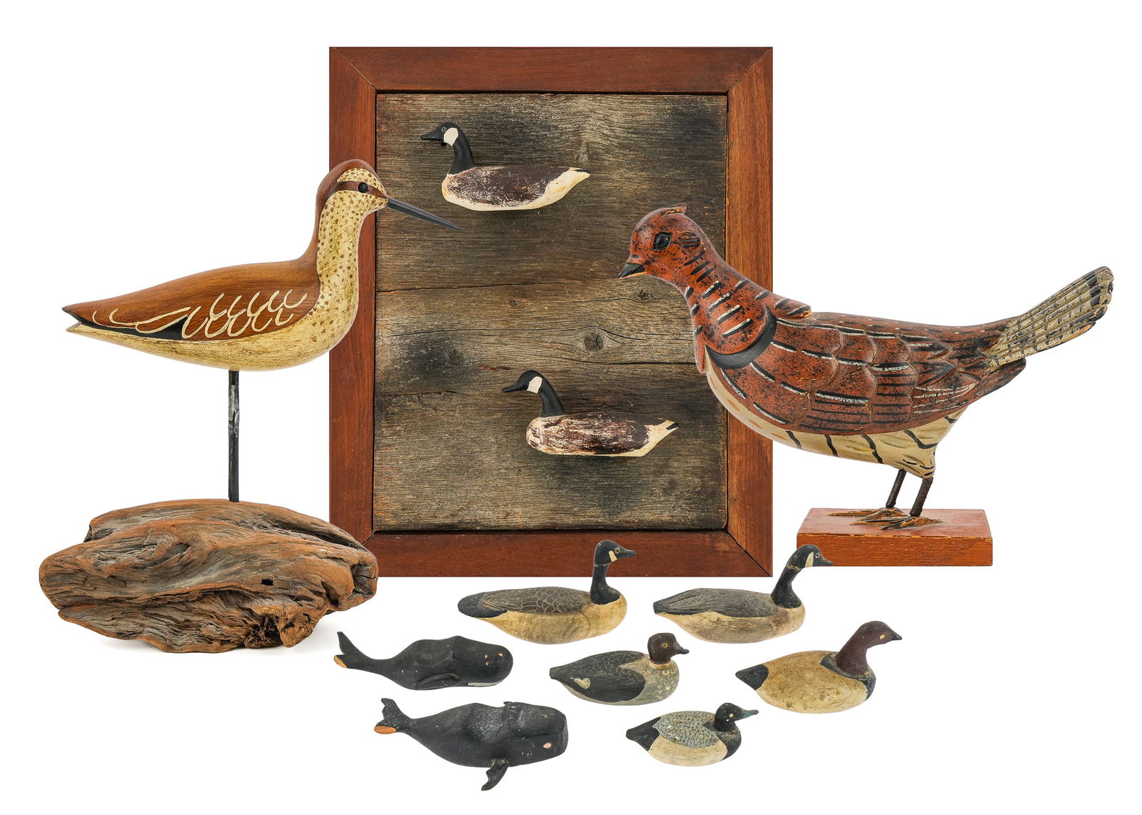 Miniature Carvings: A group of miniature carvings including a partridge by Carl Forslund, a goldeneye hen by Gerald Trombley Lake Champlain Vermont, 4 miniature Canadian geese, 2 whales (one damaged), and a shorebird.