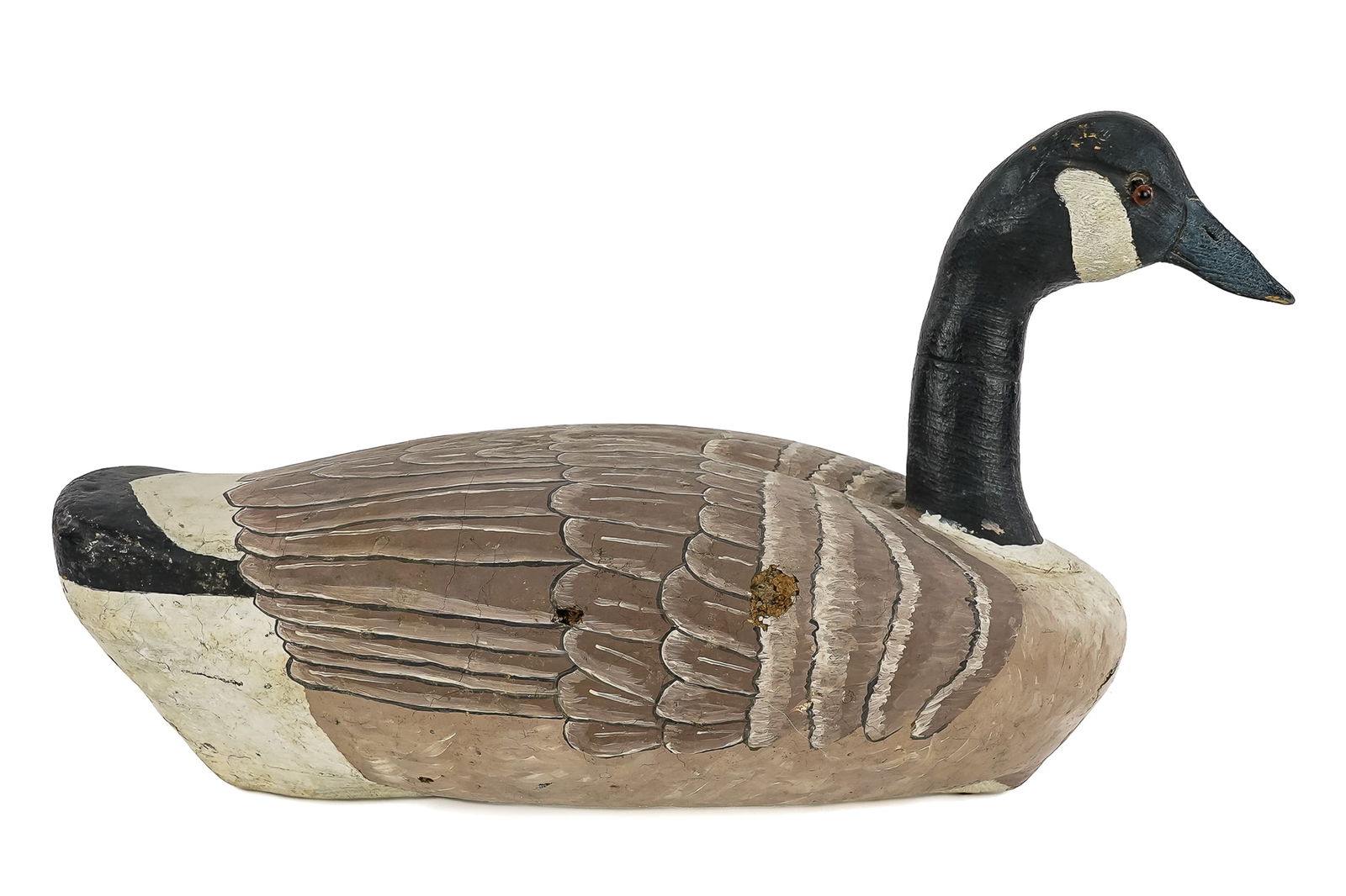 Canadian Goose Decoy: Vintage painted cork body Canadian goose decoy. Carved & painted neck & head with glass eyes. Working decoy, some wear spots. 20" x 14".