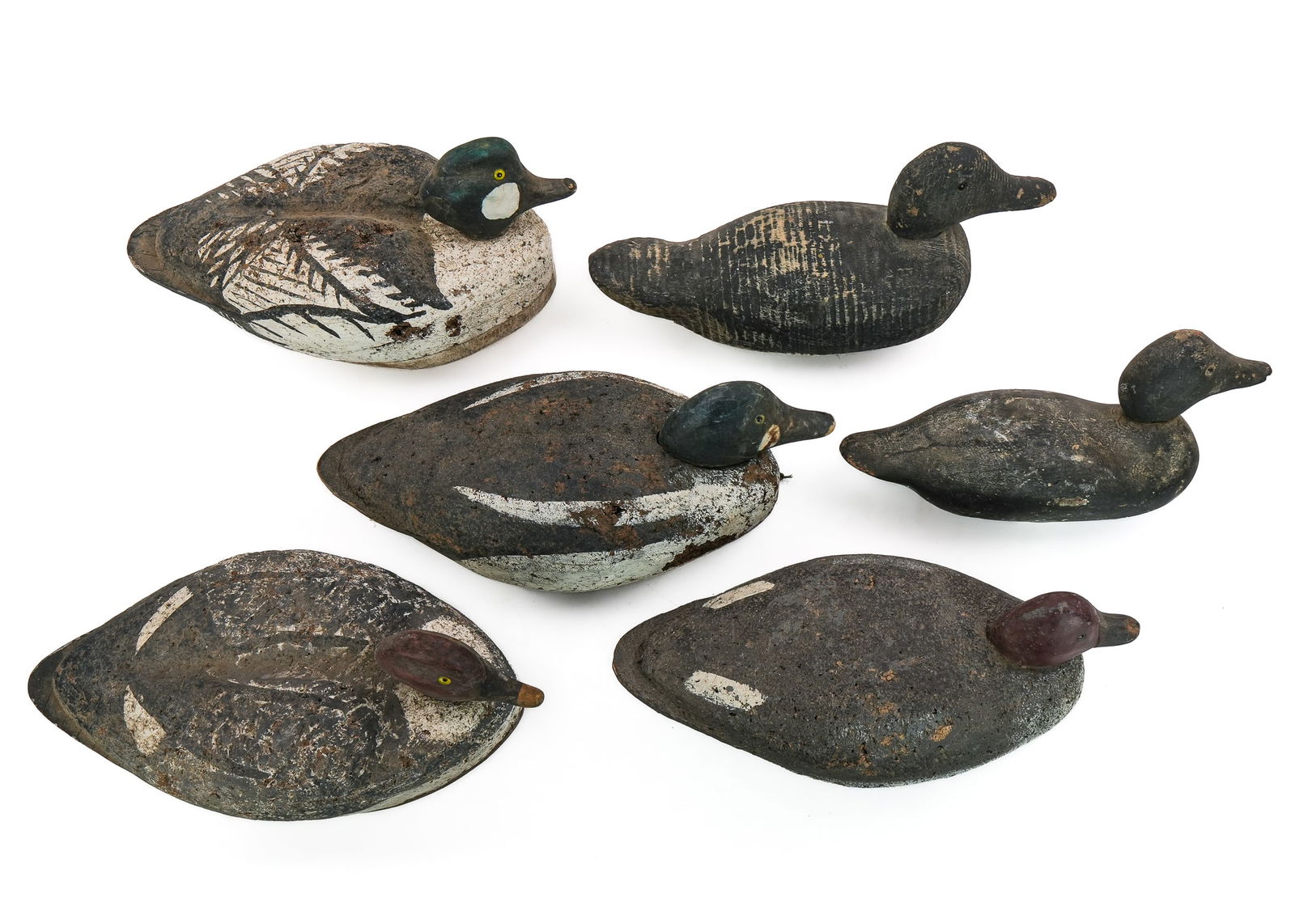 6 Vintage Decoys: A group of 6 vintage decoys including 4 Colchester Vermont cork body whistlers with carved glass eye heads, wood tails and bottoms. A Victor black duck. And a factory glass eye repaint decoy.