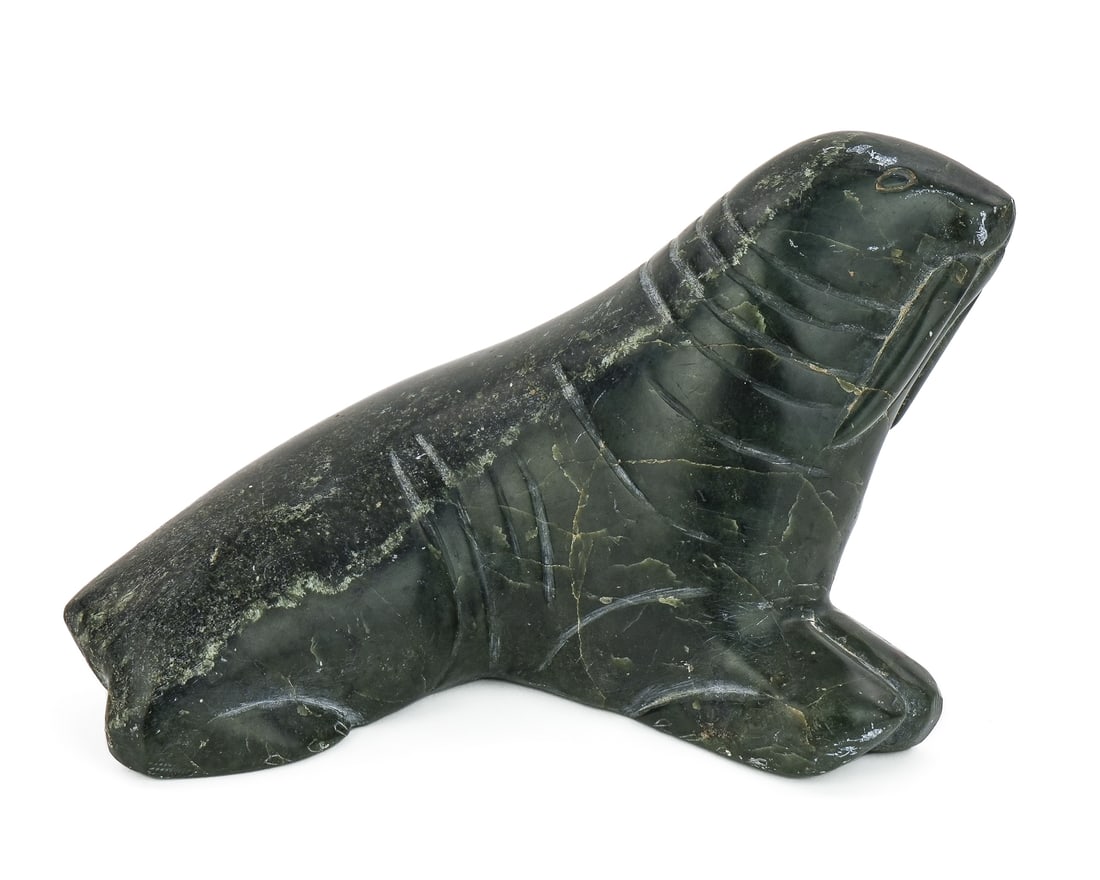 Inuit Stone Carving of a Walrus: 1974 Inuit soapstone carving of a walrus, signed illegibly in syllabics on base, Canadian Eskimo Art govt label, numbered 5-32514, length 8", ht 5"