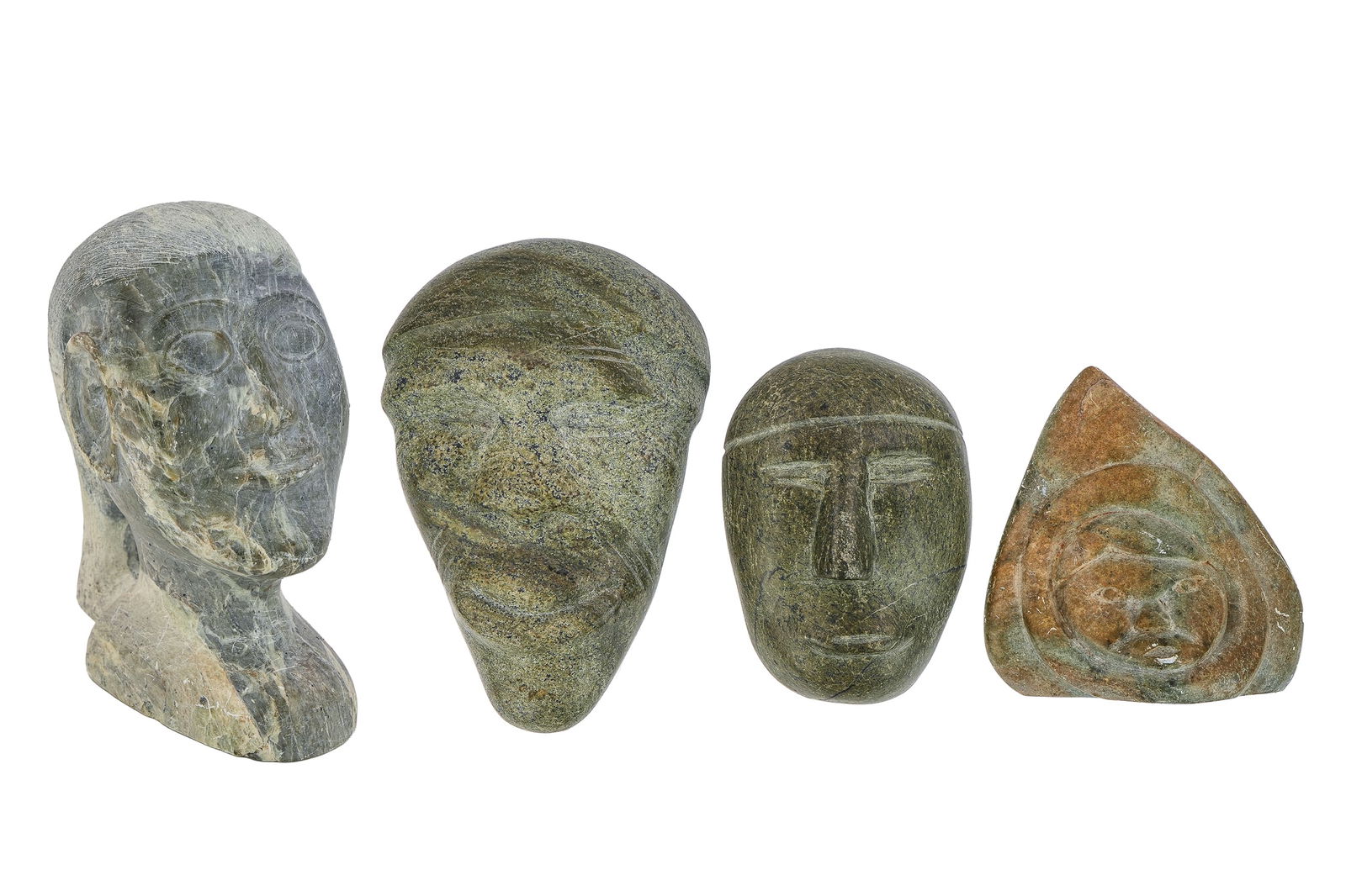 Inuit Stone Carvings of Head, Faces: Four Inuit stone carvings of head, three faces, several signed illegibly in syllabics, hts 5 1/2" to 8 1/4"
