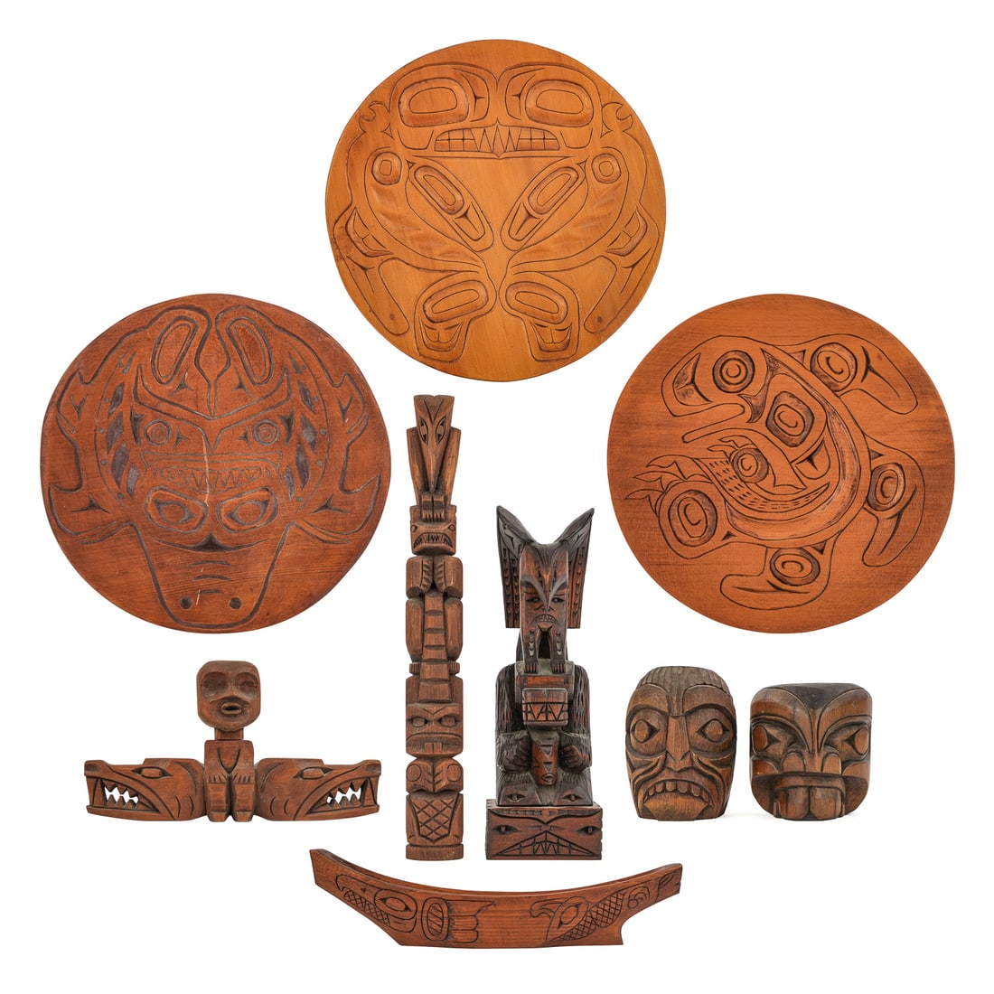 Northwest Coast Carved Woodenware: Northwest Coast carved woodenware (9 pcs), including round carved totem plaques by Albert Wesley, Allen Calder (Greenville, Nass River), Russell Calder, other totem carvings by Richard Dick, J D Wille