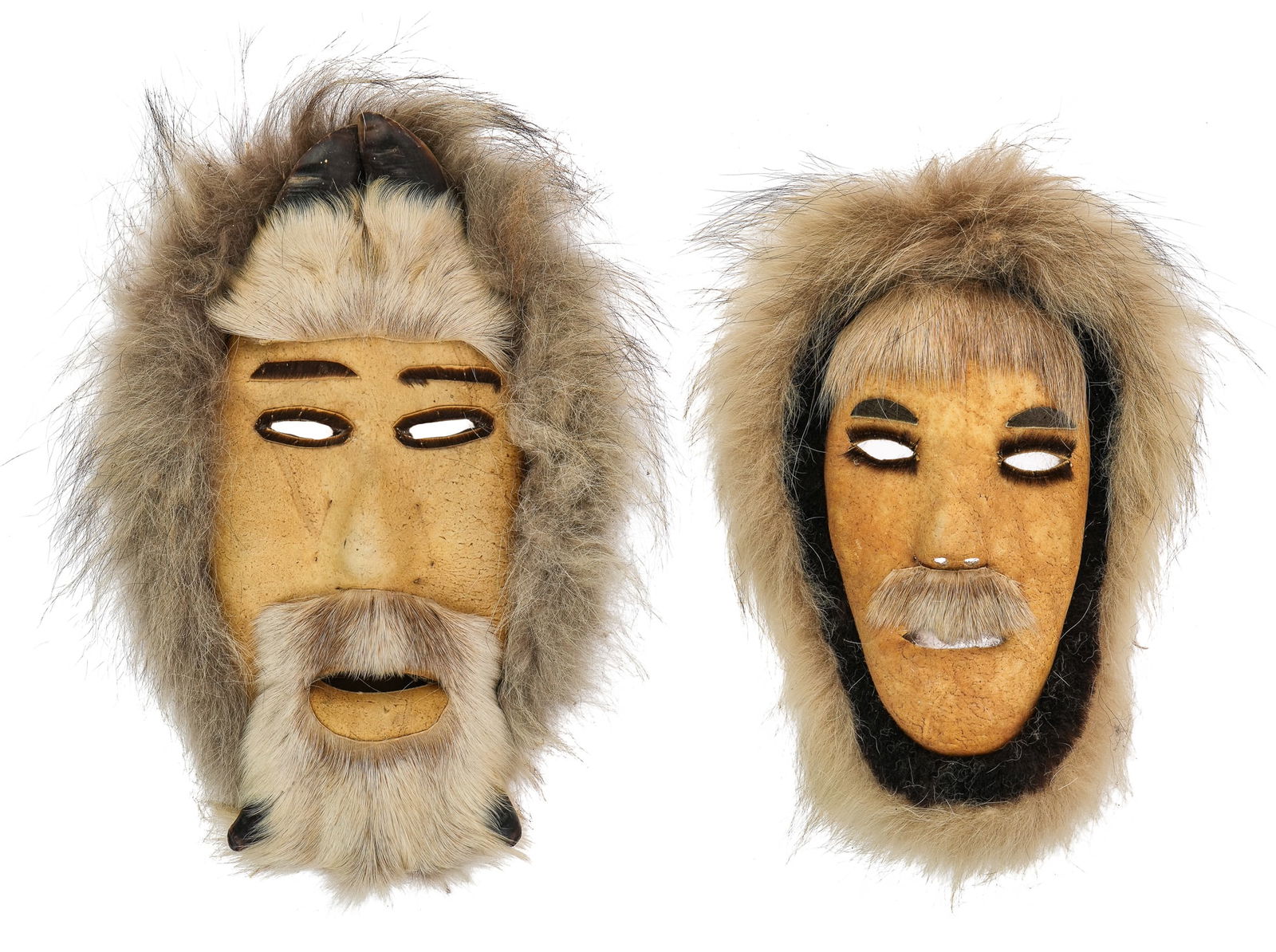 Inuit Sealskin Masks: 1950's Alaskan Inuit sealskin masks, with hair and fur, one signed