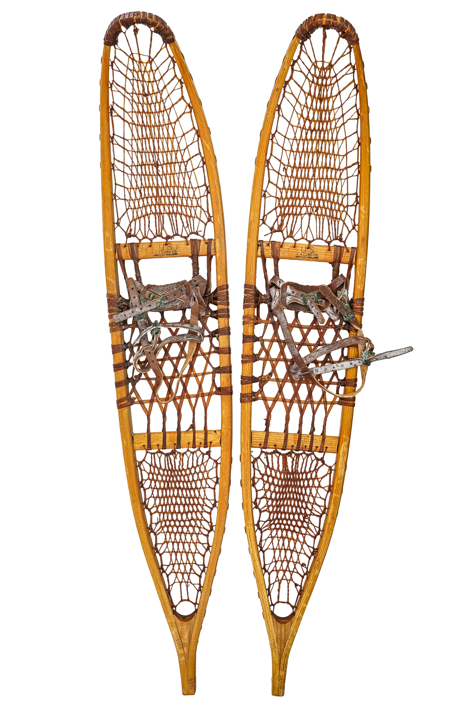 US Lund Snowshoes: US C A Lund, North St Paul, Minnesota snowshoes dated 1953, with matching serial numbers 0584, mint in original surface, with US Quartermaster instruction sheet, overall length 53"