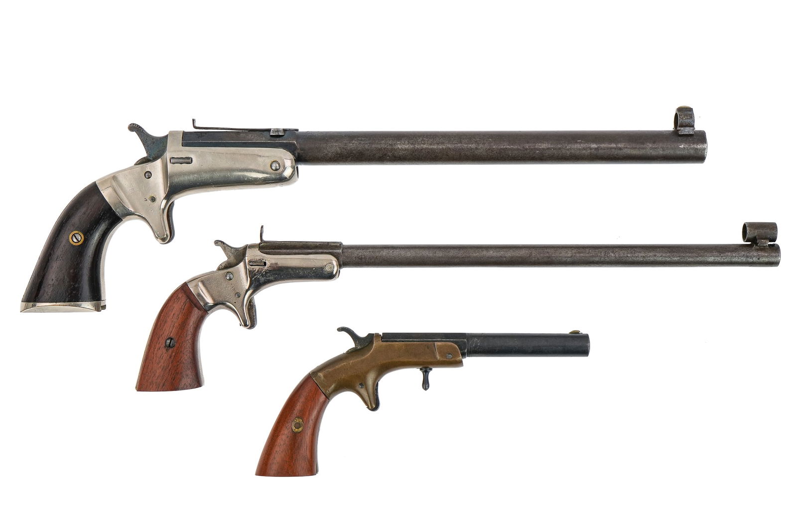 Three Spur Trigger Pistols: Three 19th c Spur trigger single shot 22 pistols- J Stevens bicycle rifle slotted for stock (Not present) with a 8" barrel nickel plated receiver overall good shape Serial # 1010 , Unmarked target pis