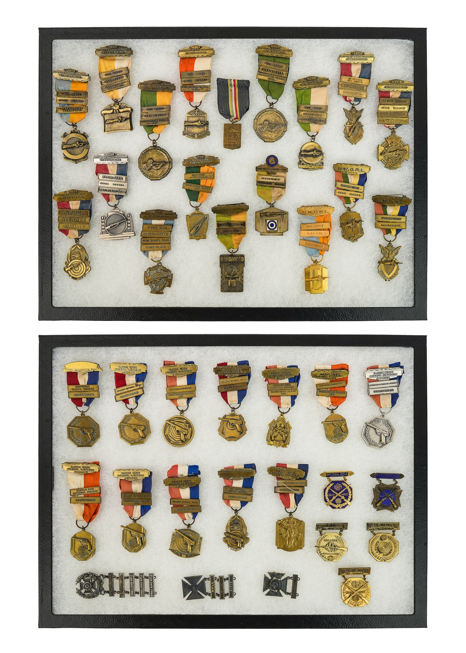 NRA Pistol & Rifle Marksmanship Medals: Mid 20th c Elmer E Waggoner (1889-1968 Sandusky Co, Ohio) NRA, Pistol, Rifle match marksmanship medals (36 pcs). Mr Waggoner was owner of the Freemont Gun and Athletic Supply Co and a member of the