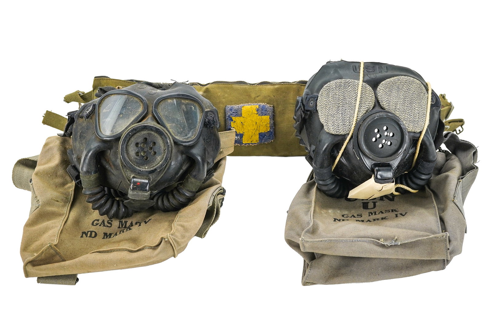 Navy Gas Masks, First Aid Belt Pack: Two US Navy universal ND Mark IV gas masks (one mint in box), sold with a mid 20th c first aid belt with an early National Ski Patrol blue & yellow cross patch