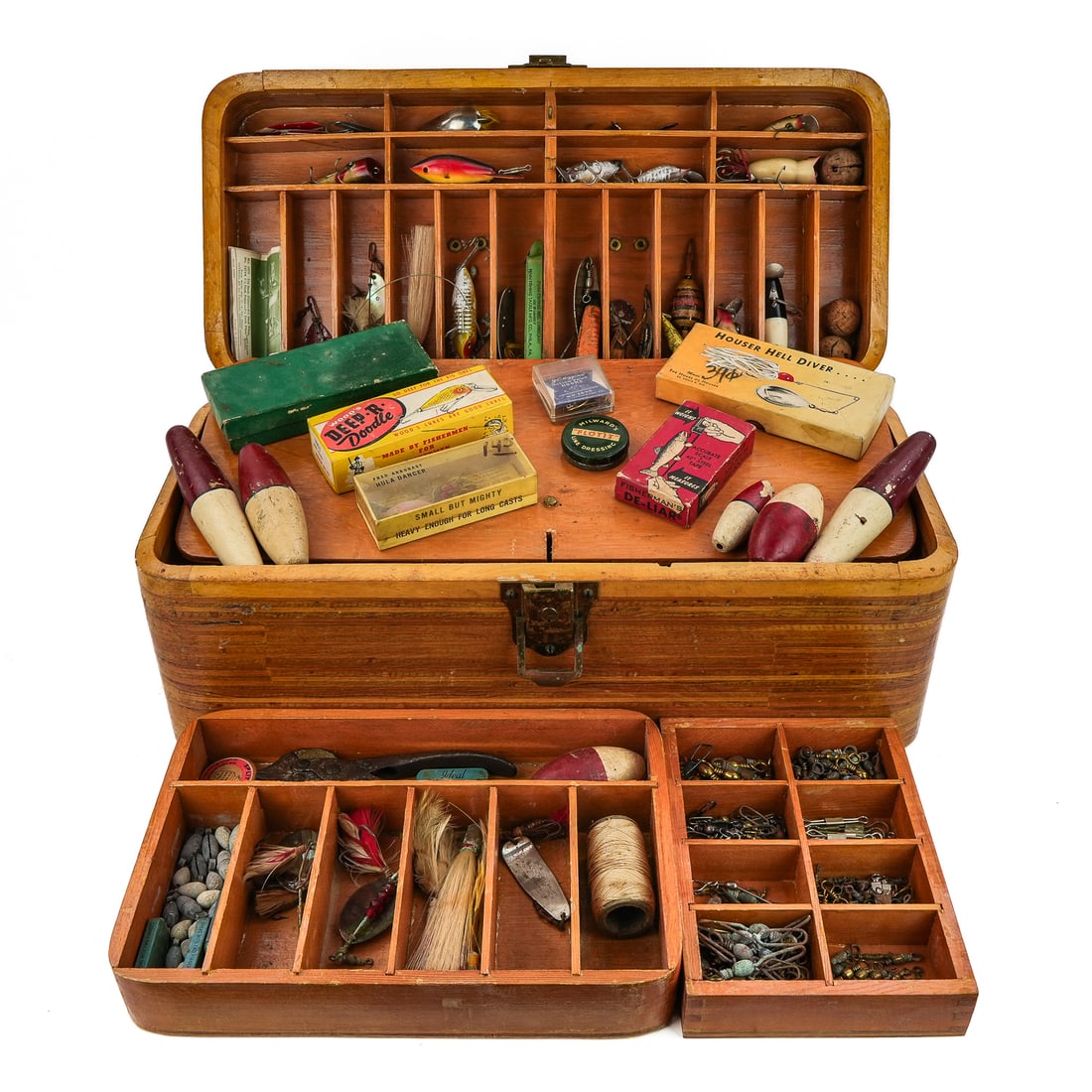 The Sportsman Vintage Tackle Box & Contents: The Sportsman made by J W Gilson Stuart FL vintage tackle box with contents of vintage lures, bobbers, early spinners & spoons, jigs, two fish spear heads, and other equipment.