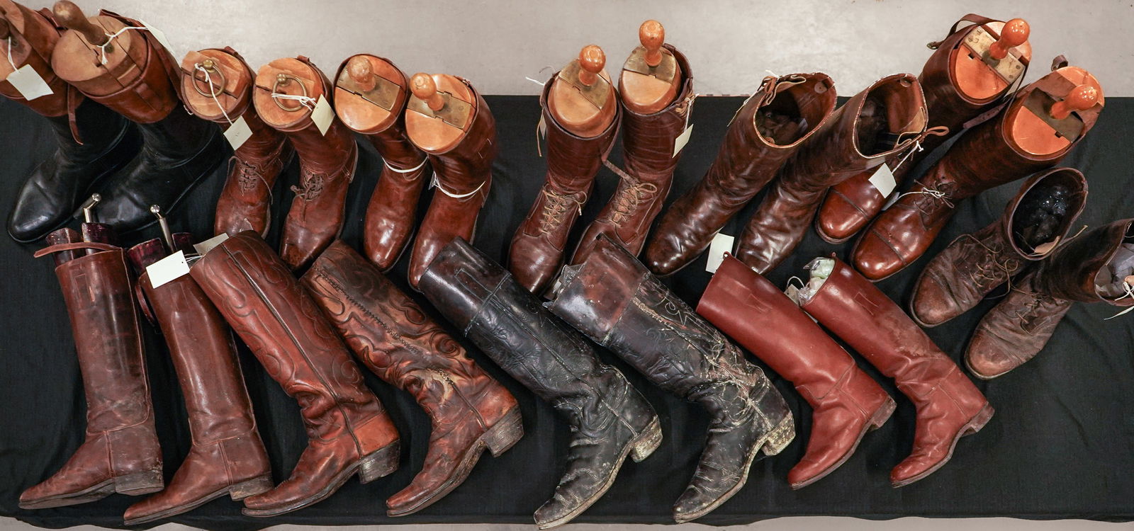 11 Pairs Vintage Riding Boots: A group of 11 pairs of vintage riding boots from Shelburne Farms. English London size 8 1/2, with brass mounted stretchers. 2 pairs of Western boots brown and black approx size 9. English, size 9, wit