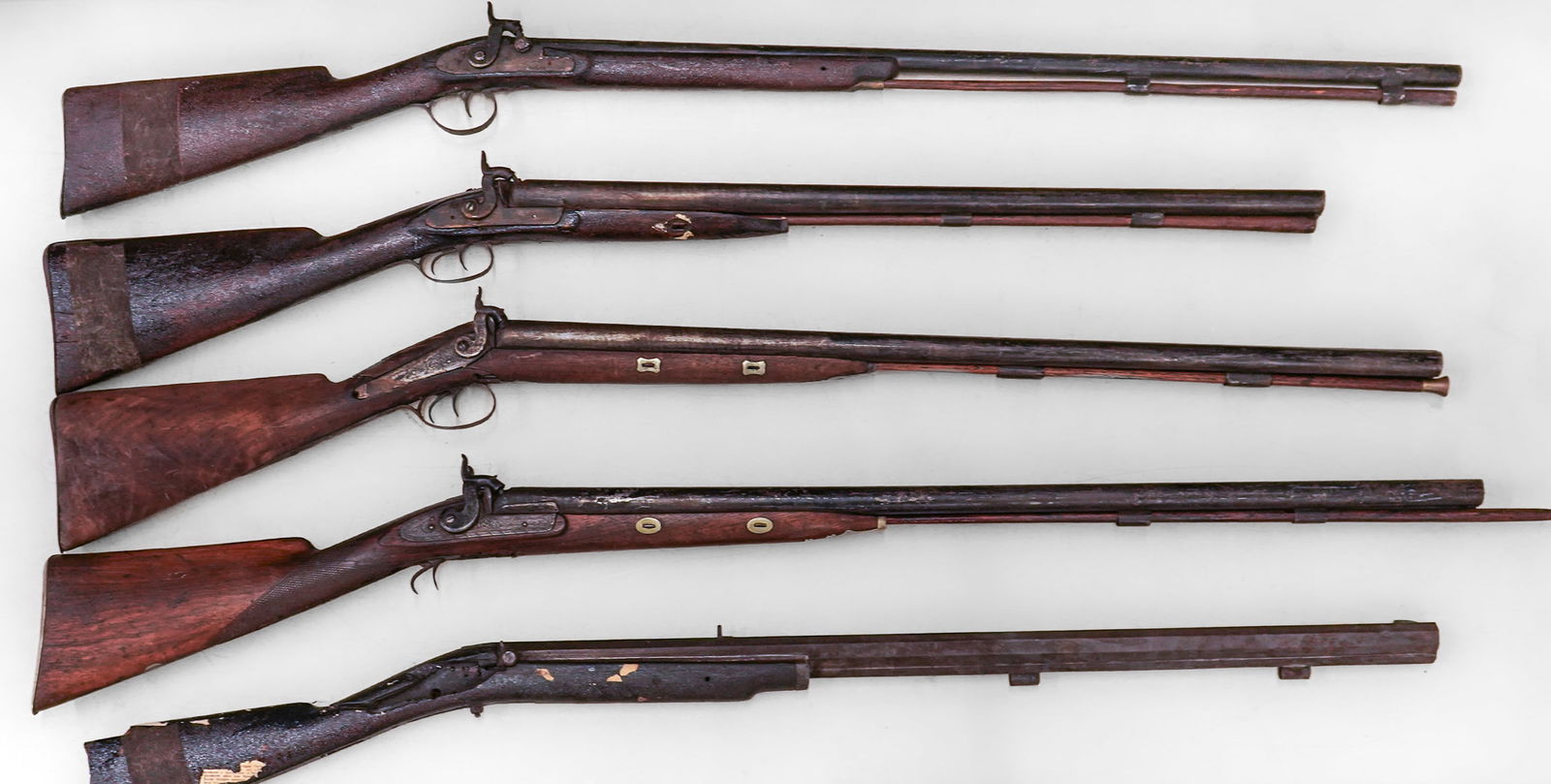 Target Rifle, Fowler, Shotguns- as found: NE percussion target rifle with heavy octagonal barrel (length 32 1/1", missing lock), Willain Read, Boston percussion double barrel damascus shotgun, two other unmarked damascus barrel percussion
