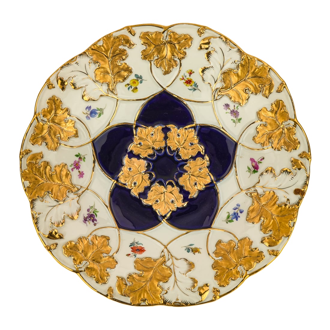 19th c. Meissen Embossed Porcelain Cabinet Plate: 19th c. Meissen embossed porcelain cabinet plate having gilt foliate decoration surrounding hand painted floral sprays and cobalt blue center. Crossed swords underglaze mark on reverse. 2" x 11"