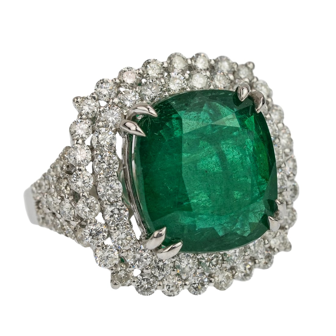 Fine 7.8 CT Emerald & Diamond Ring: 18k white gold set with a natural emerald cut emerald measuring 13.5 mm x 12.5 mm x 5 mm or approx. 7.8 cts. , with 80 round cut diamonds in surround of .02 ct & .03 ct. Approx. 2.3 CT.T.W. diamonds.