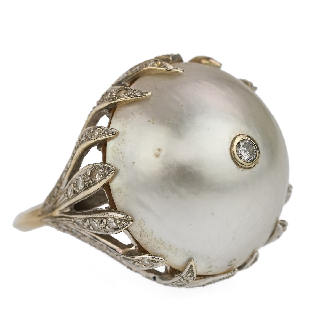 14k Pearl & Diamond Ring: Wonderful 14k white gold ring with a center 19mm luster south sea pearl having the top set with a .05 ct rd cut diamond in a bezel. Surrounding the pearl 16 white gold leaves, each set with small