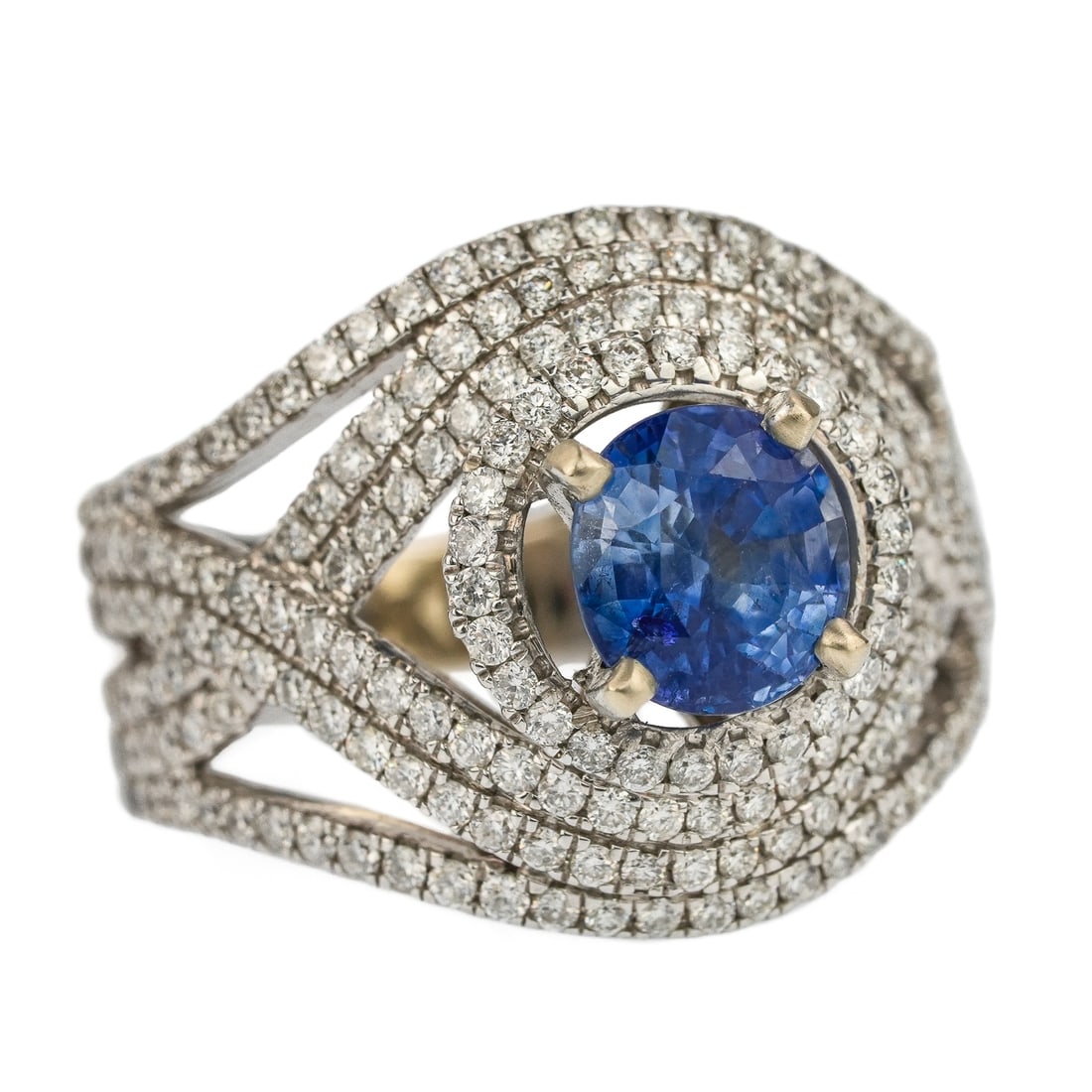 2 CT Sapphire & Diamond Ring: Modern 14k white gold ring set with a center natural round cut 2 ct sapphire, having 4 surrounding bands set with small round cut diamonds, approx. 1 ct.t.w. Ring size 5.5.