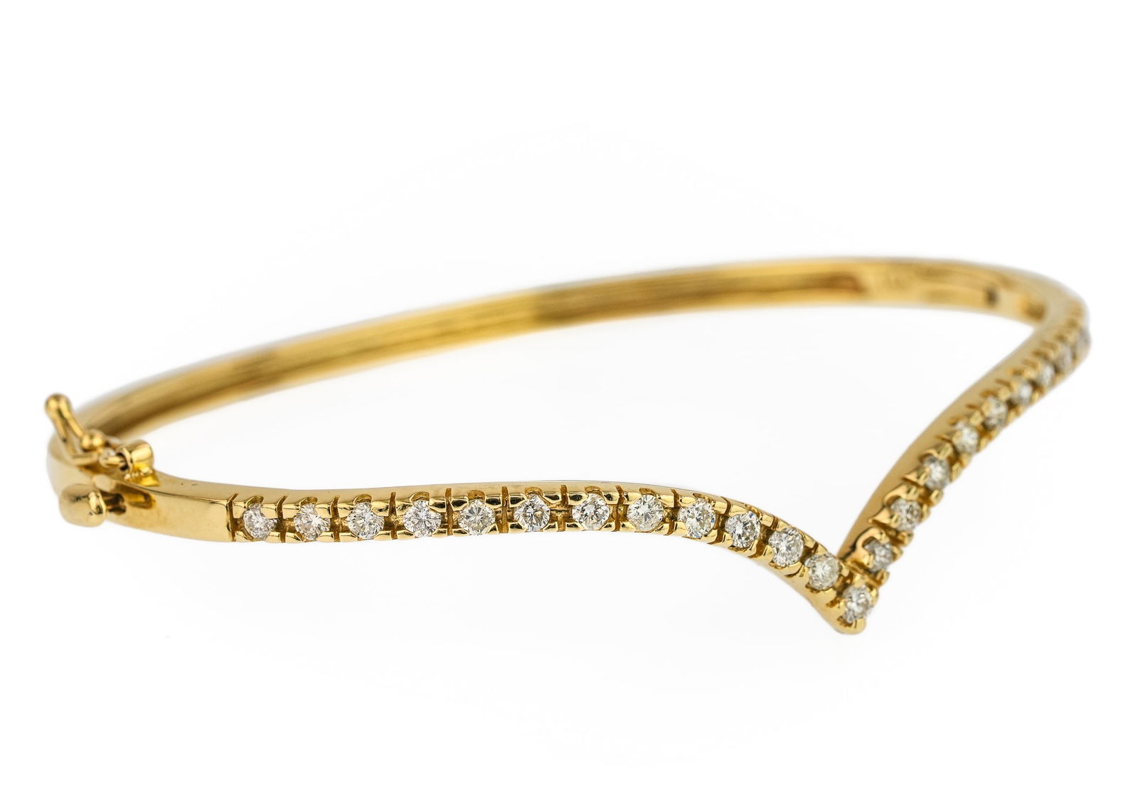 1.5 CT Diamond Bangle: 14k yellow gold bracelet set with 25 round cut diamonds, approx. 1.5 CT.T.W diamonds. 2 3/4" diameter. 10.2 grams t.w.