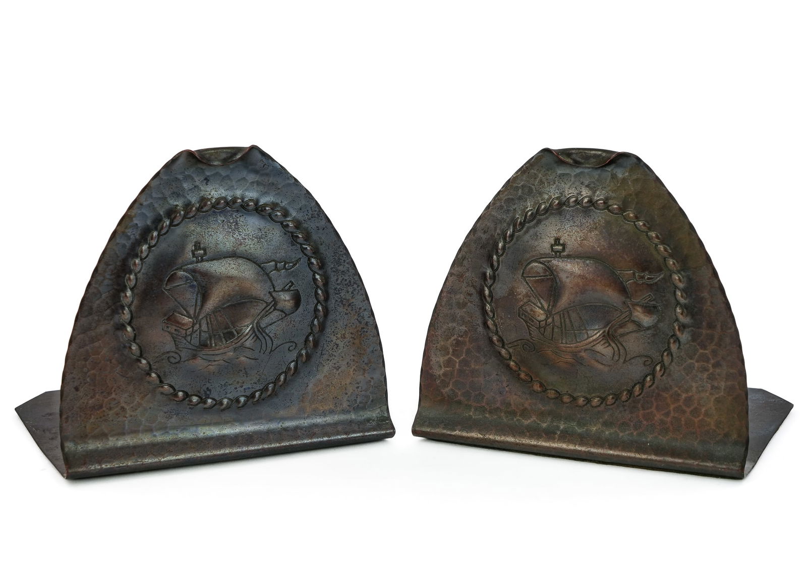 Roycroft "Galleon" Bookends: Pair of Roycroft Arts & Crafts "Galleon" bookends, East Aurora, NY, hand hammered copper, mid Roycroft orb, Aurora finish, ht 5"