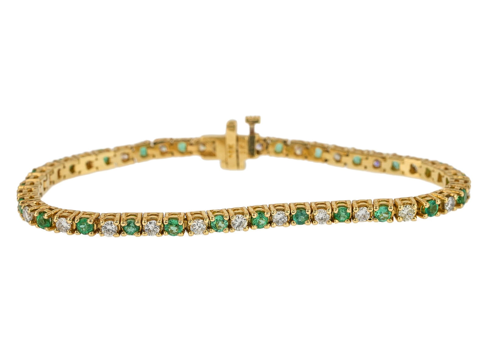 Diamond & Emerald Yellow Gold Tennis Bracelet: A 14k yellow gold tennis bracelet set with 26 round cut .08 ct diamonds or approx. 2.08 CTS.T.W. with 25 round cut .05 ct emeralds, or 1.25 CT.T.W. 7"long, 13.9 grams t.w.