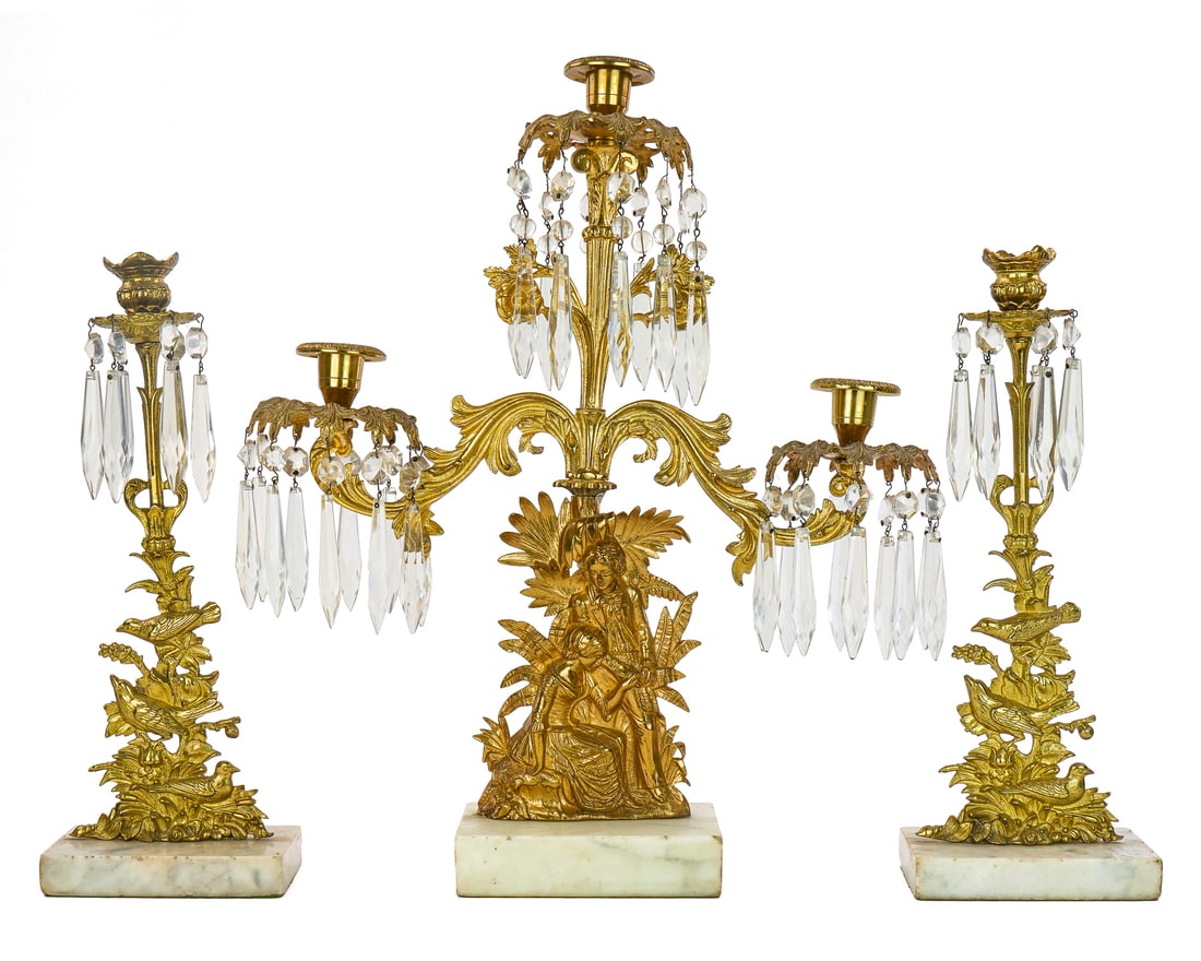 Gilt Brass Three Piece Girandole Set: Ca 1890 gilt brass prismed girandole set with figural triple candelabra, pr of single candlesticks with birds, white marble bases, hts 18 1/2", 14 1/2"