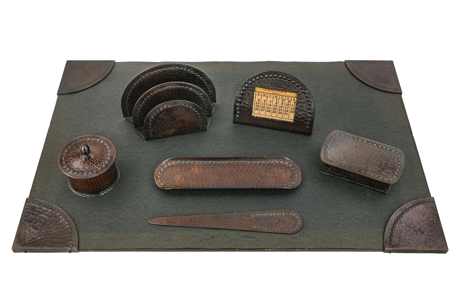 Roycroft Rope Braid Desk Set Pieces: Roycroft "Rope Braid" desk set pcs (10 pcs total), including 4 blotter corners, inkwell, letter holder, calendar, pen tray, letter opener, stamp/ postage box, all with Aurora finishes