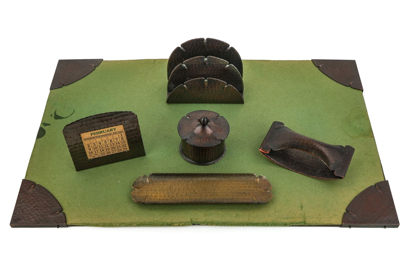 Roycroft Lunar Notched Desk Set Pieces: Roycroft Lunar "Notched" desk set pcs (8 pcs), including 4 blotter corners, inkwell, letter holder, pen tray, rocker blotter, sold with a plain hammered copper calendar, all with Aurora or brass