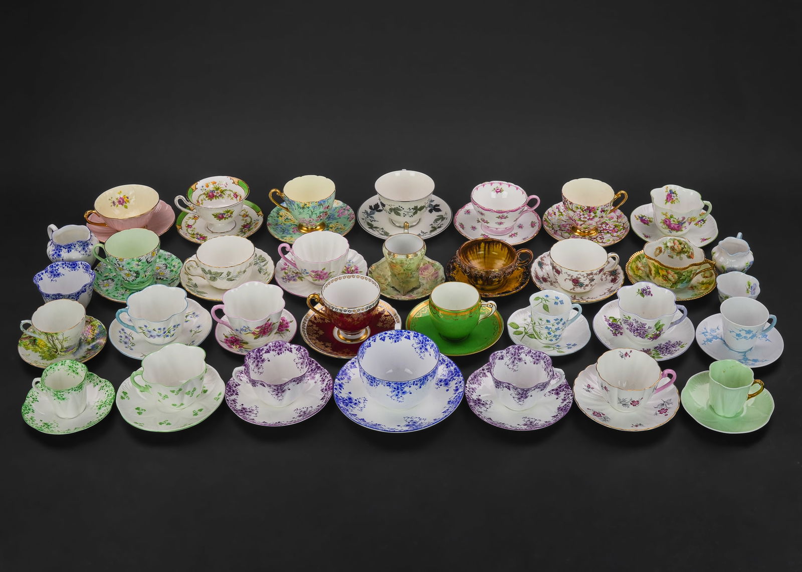 Collection of 28 Porcelain Tea Cups and Saucers: Collection of 28 fine porcelain tea cups and saucers, many bone china by English makers including Shelley, Minton, Royal Doulton, Spode, Royal Rudolstadt, Royal Bayreuth Rose Tapestry, etc. accompanie