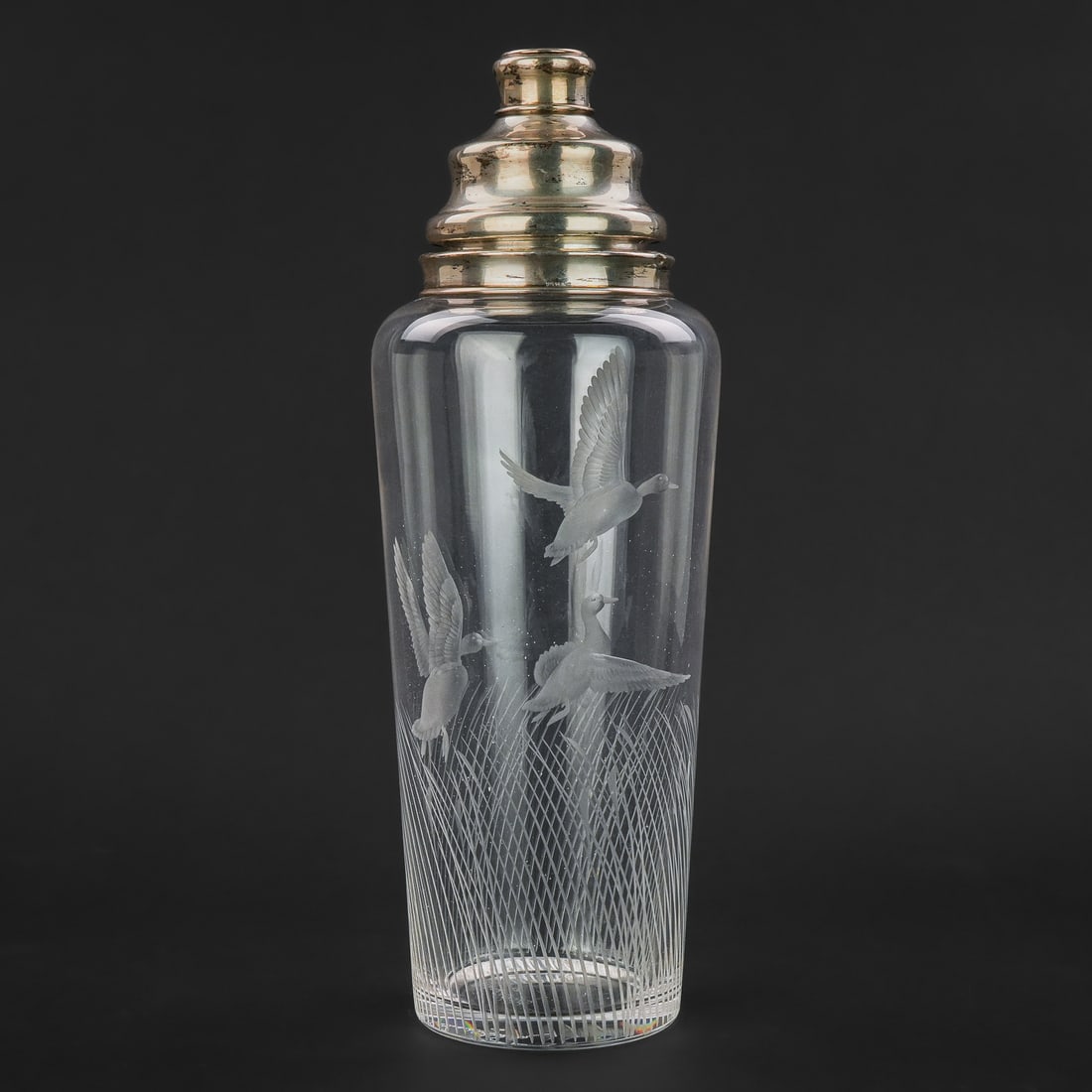 Hawkes Sterling and Crystal Cocktail Shaker: Fine signed Richard Bishop for Hawkes ABP crystal cocktail shaker having wheel engraved decoration of mallard ducks in flight with sterling banded rim and strainer cap also signed "Hawkes Sterling."