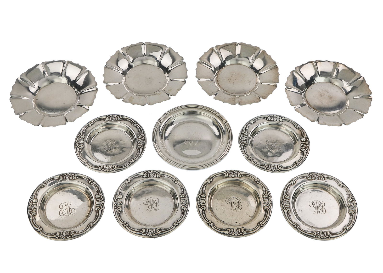 11 Sterling Silver Butter Pats: Group of 11 sterling silver butter pats including 6 Gorham with rococo repousse borders, 4 Webster scalloped edge, and one Gorham molded edge 3"-4" 8.9 ozt.
