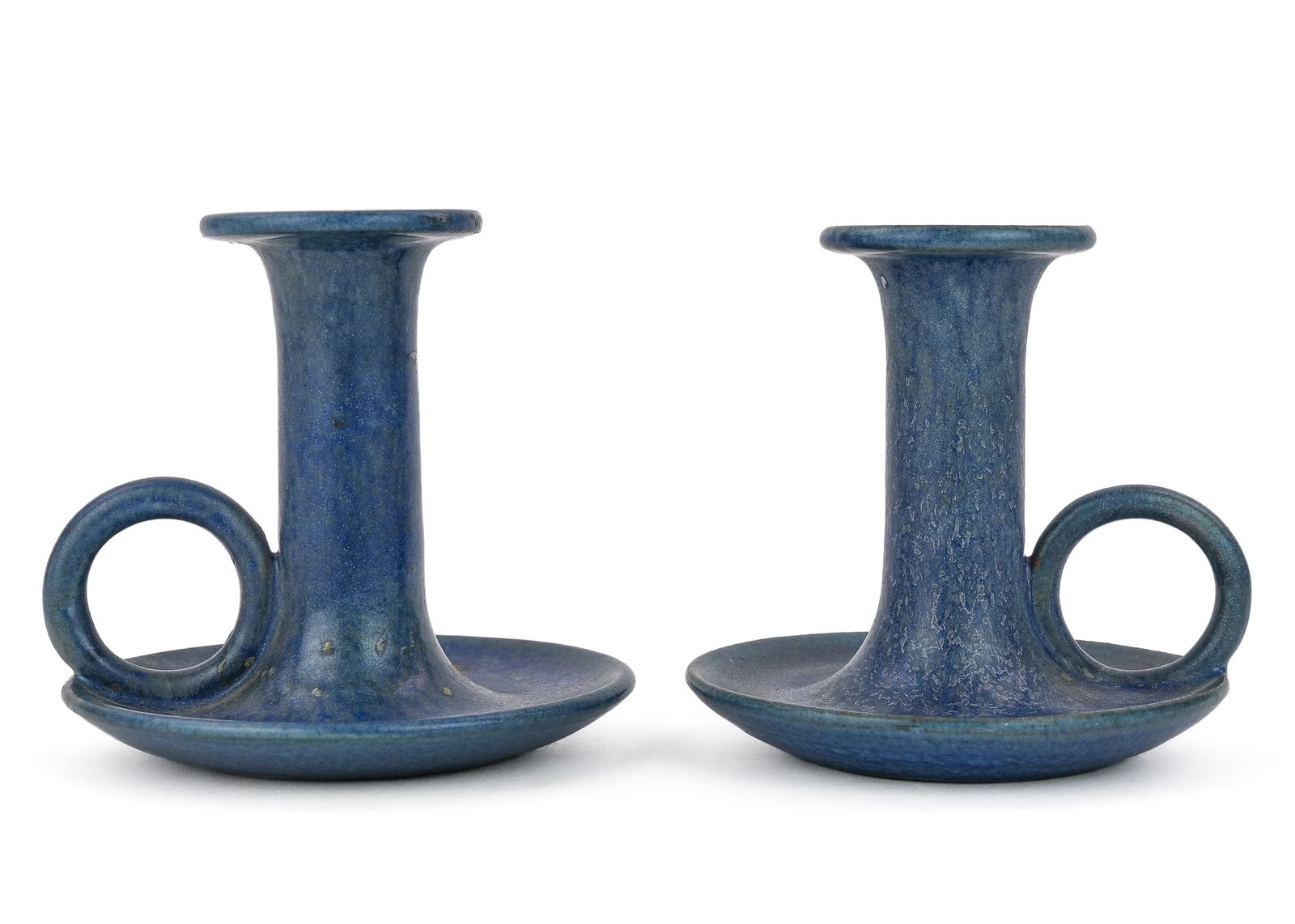 Pair of Marblehead Pottery Candlesticks: Pair of ca. 1910 Marblehead Pottery Arts and Crafts era candlesticks in mottled matte blue glaze with finger loops, embossed underglaze mark, overall very good condition 4"x 4"
