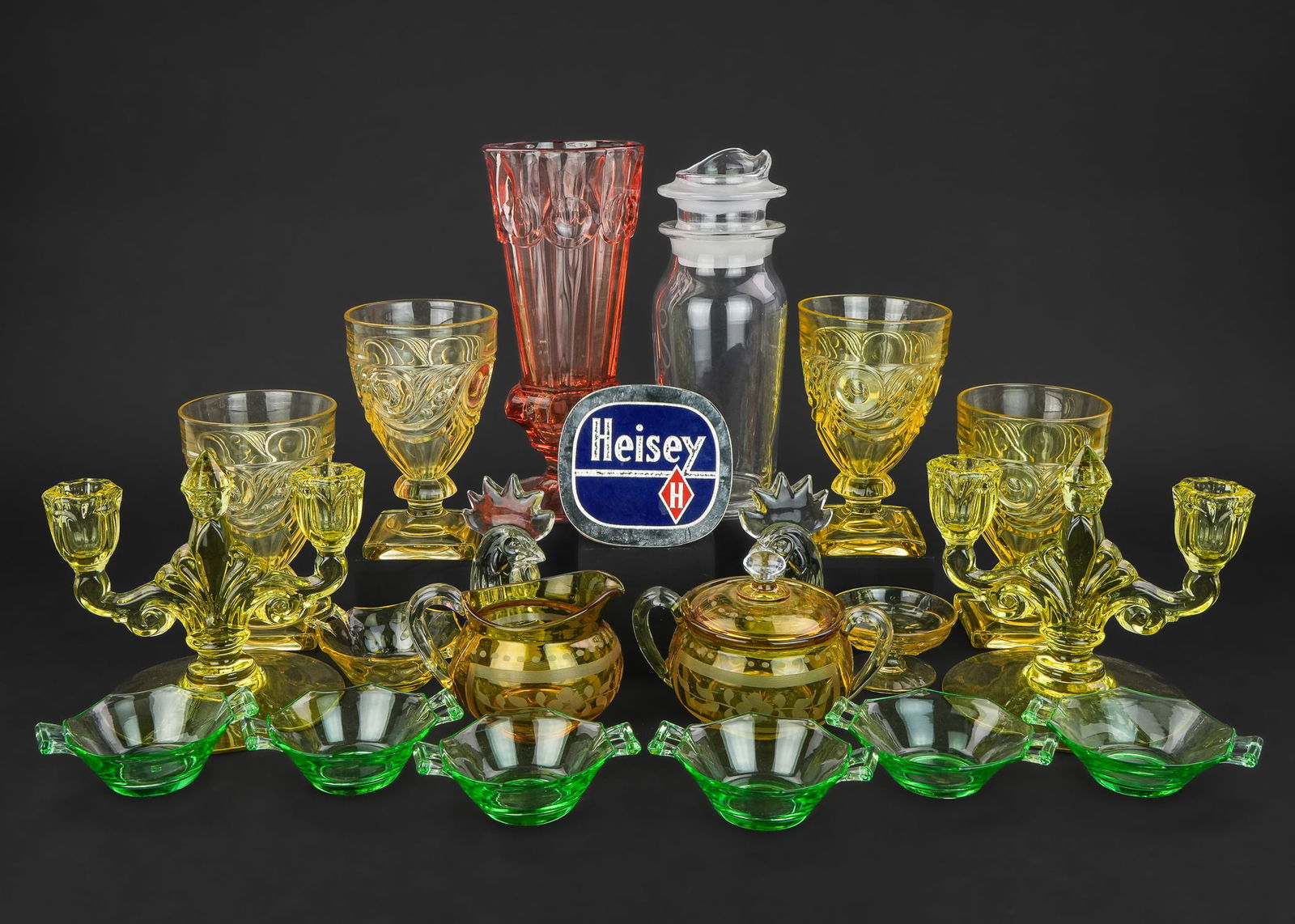 Heisey Glassware including Sahara Pieces: Collection of assorted Heisey Elegant Depression Era glassware including 4 Ipswich Sahara yellow footed water goblets, pair of Sahara yellow candelabra, yellow flashed covered sugar bowl and creamer,