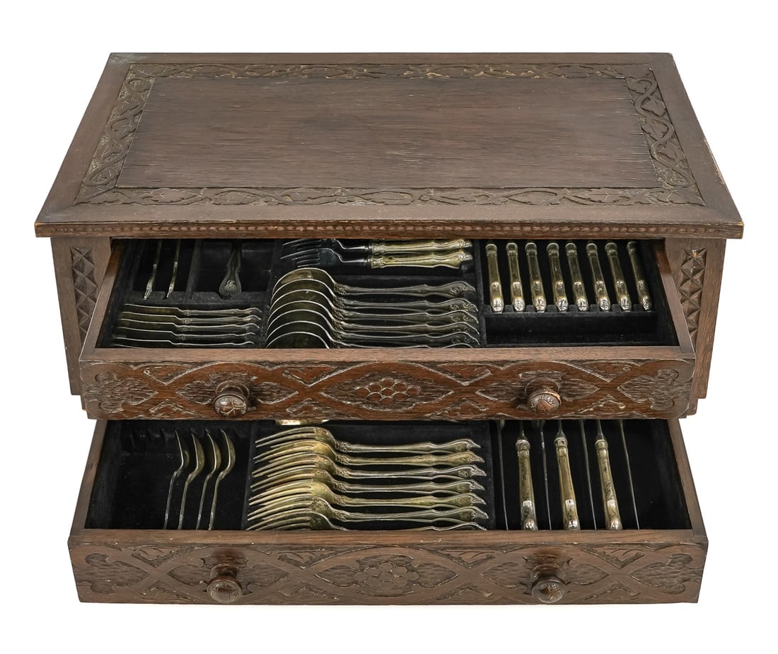 German Arts & Crafts Flatware Case: German Arts & Crafts era carved oak wooden two drawer fitted case box, carved details, sold with a German silver flatware set, wooden case 26" x 14 1/2" x 9 3/4"