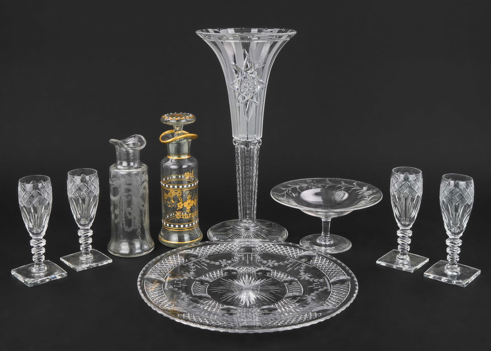9 pcs. Hawkes Brilliant Cut Glass Tableware: Collection of 9 pcs. of signed Hawkes brilliant period cut glass tableware including a striped and star cut trumpet vase, a serving plate, small tazza, a gilt engraved oil and vinegar bottle, another