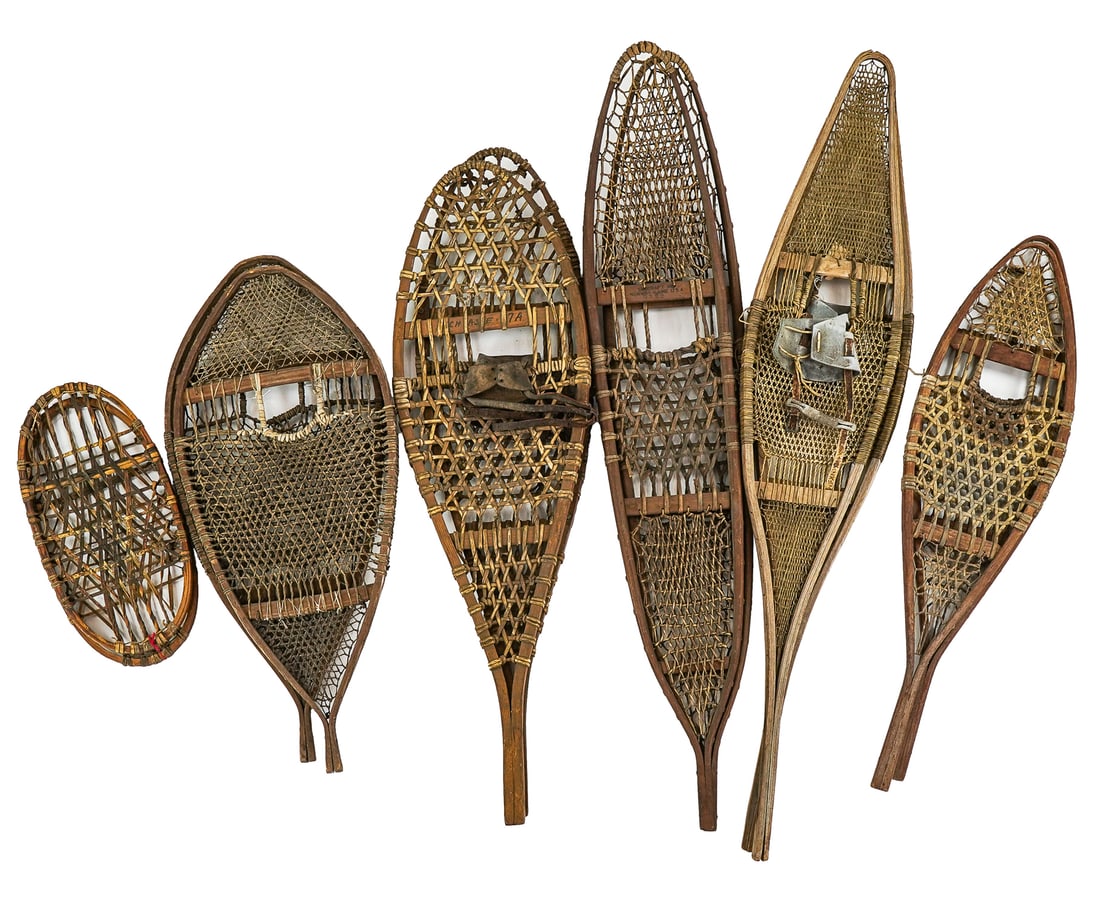 6 pairs of Vintage Ash Snowshoes: 6 pairs of vintage bent ash and woven rawhide snowshoes including small bearpaws, extra long pair SnoCraft Norway, Maine 20"-60" -some repairs and imperfections