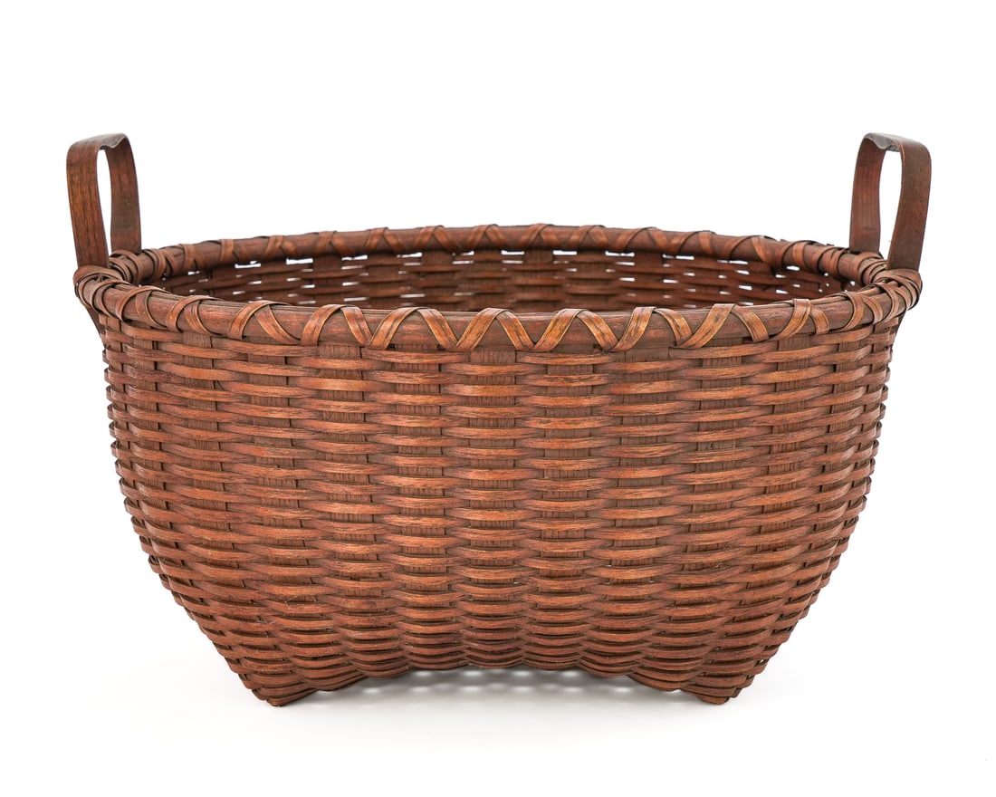 Shaker Type Two Handle Basket: Shaker type two handle "cat's head" basket, excellent condition, diameter 13 1/2", basket body ht 6 1/2", overall with handles 13 1/2" x 13 1/2" x 9"