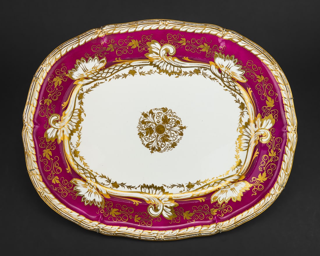 19th c. Davenport Porcelain Serving Platter: Fine large mid 19th c. Davenport English porcelain oversized serving platter having embossed acanthus rim surrounding gilt foliate and burgundy border, later wire frame added on reverse for hanging,