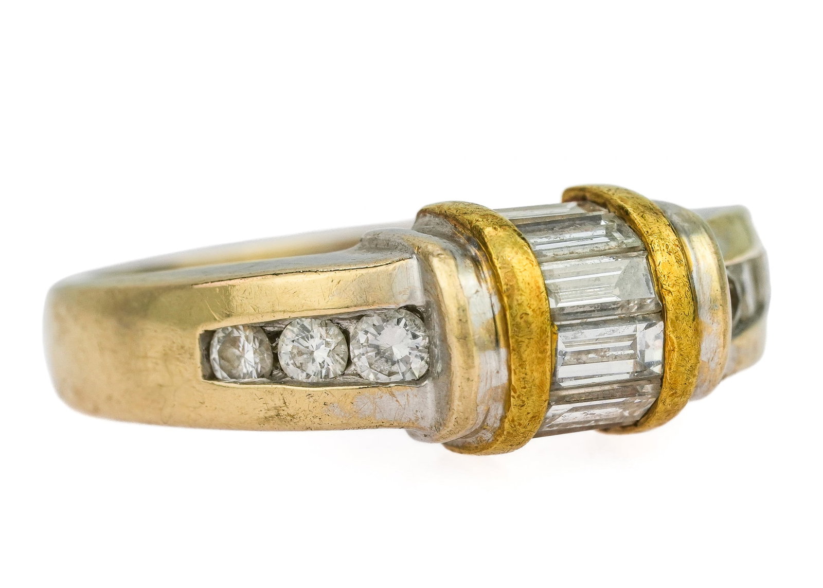 18k & 2/3 CT Diamond Modern Ring: 18k white gold ring set with 6 .03 ct diamonds and center barrel design having 6 baguette cut diamonds .08 ct each with yellow gold bands on each side. Approx. 2/3 CT t.w. Ring size 6.5
