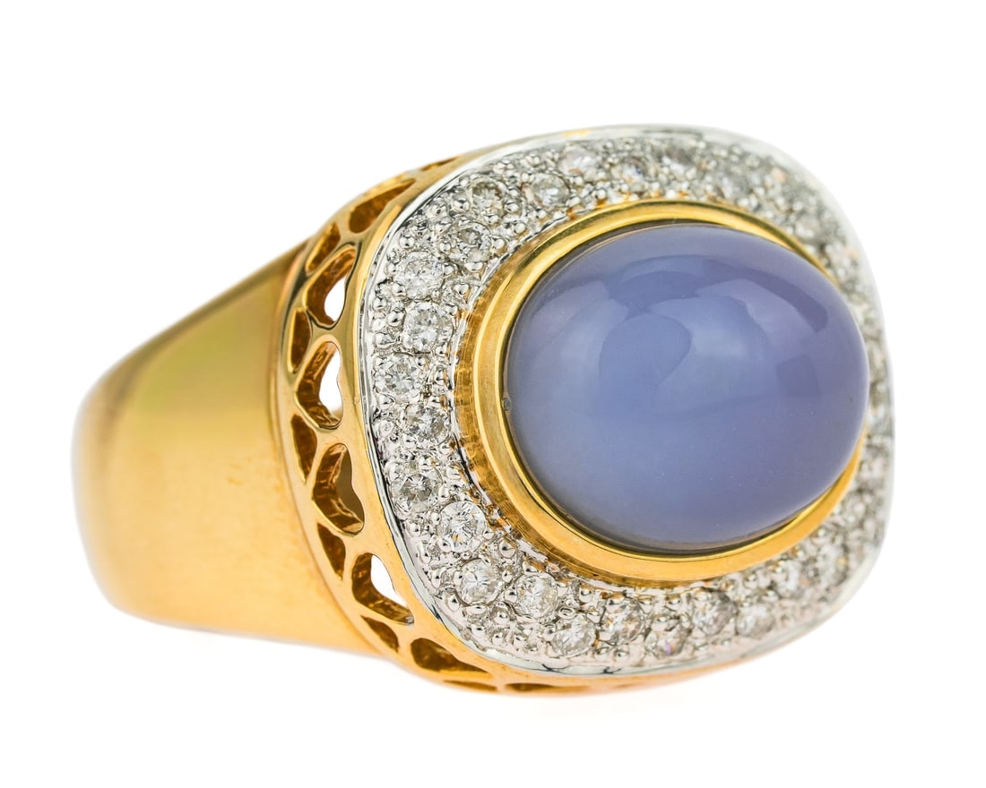 14k Chalcedony & Pave Diamond Ring: 14k yellow gold ring set with oval cabochon Chalcedony 12 mm x 10 mm with a pave diamond surround, approx. 30 .01 ct diamonds. Ring size 7.