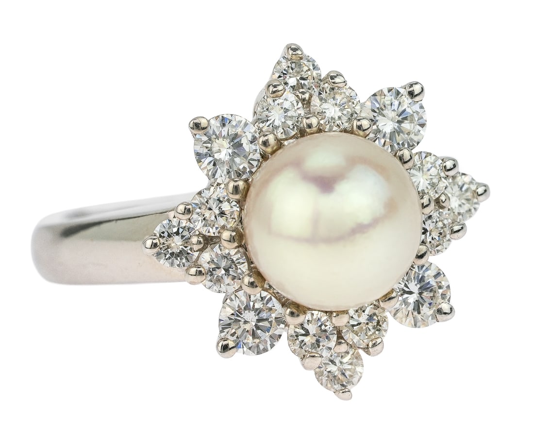14k Diamond & Pearl Ring: 14k white gold ring set with a center 8 mm pearl having 8 pedal design surround - 4 .05 ct round cut diamond pedals and 4 pedals with 3 .02 ct diamonds. Ring size 7.