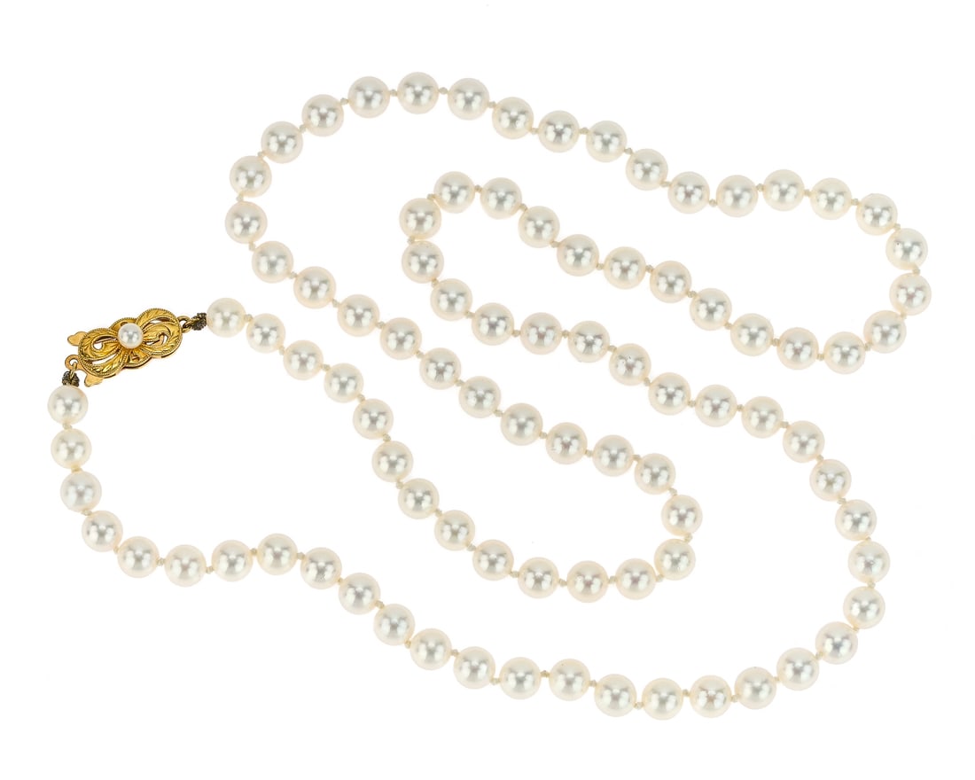27" Pearl Necklace: 27" long pearl necklace with 6.5 mm pearls, and a 18k yellow gold clasp.