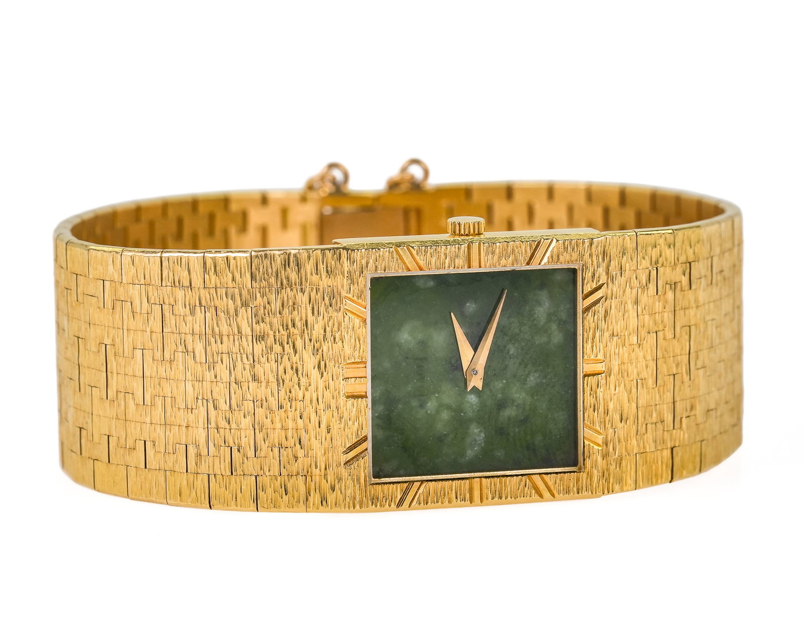 18k Piaget & Jade Wristwatch: 18k yellow gold Piaget wrist watch with rectangular face. Deep green jade face, yellow gold hands, exterior edge of case with impressed hash marks for hours. 23 mm wide case. 7" long. Case marked