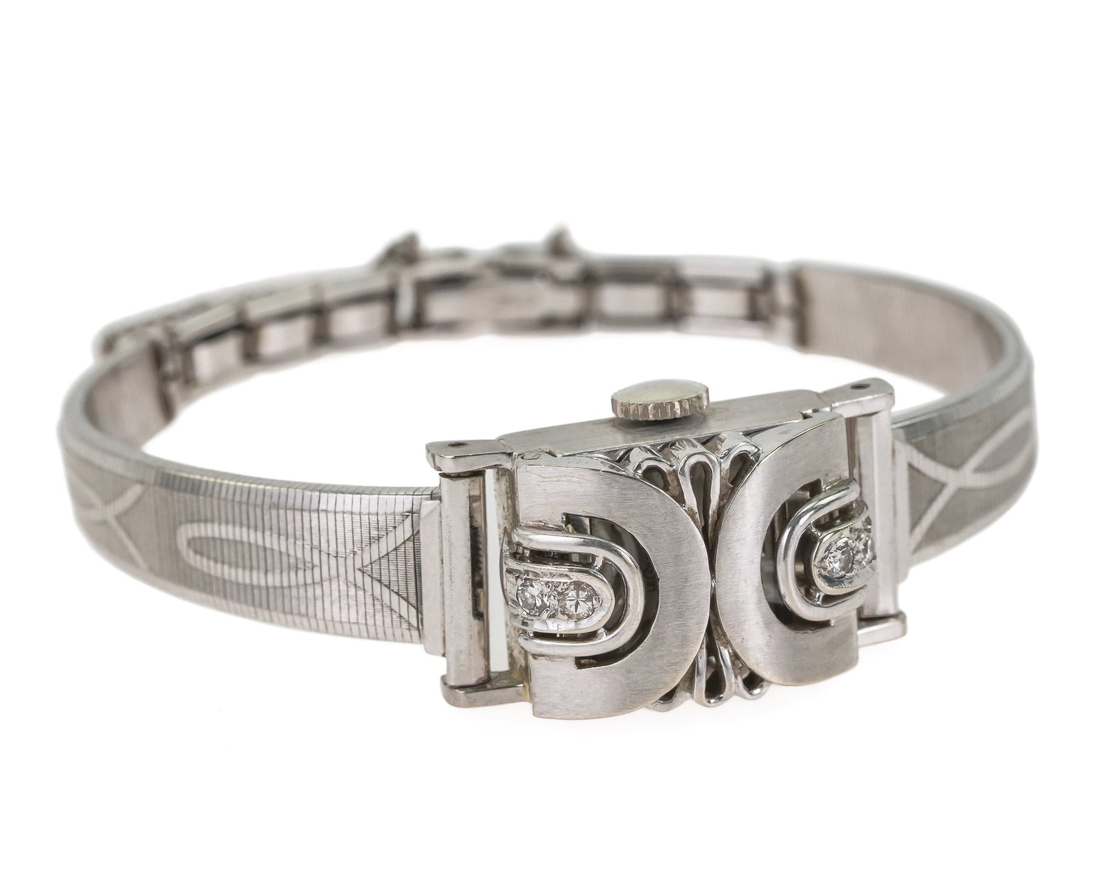 LeCoultre 18k & Diamond Closed Face Wristwatch: LeCoultre 18k white gold wrist watch with a closed spring hinged covered having 4 .04 ct round cut diamond. Face marked LeCoultre. Case measures 14 mm x 18 mm. Plated white gold band. In original