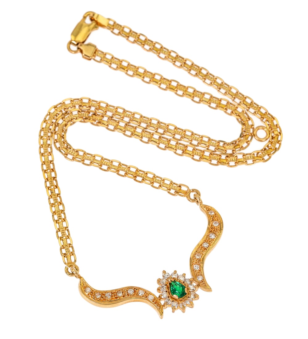 18k Emerald & Diamond Necklace: 18k yellow gold necklace set with 27 small round cut diamonds and center pear cut emerald approx. .35 CT. 14.1 grams t.w. 16" long.
