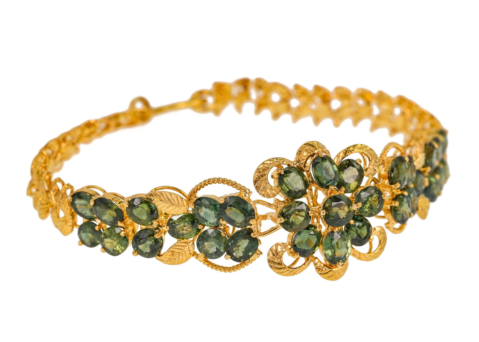 22K 8 CT Green Sapphire Bracelet: 22k yellow gold bracelet set with 20 oval cut green sapphires approx. .4 CT each or 8 CT t.w. 7" long. 16.5 grams t.w.