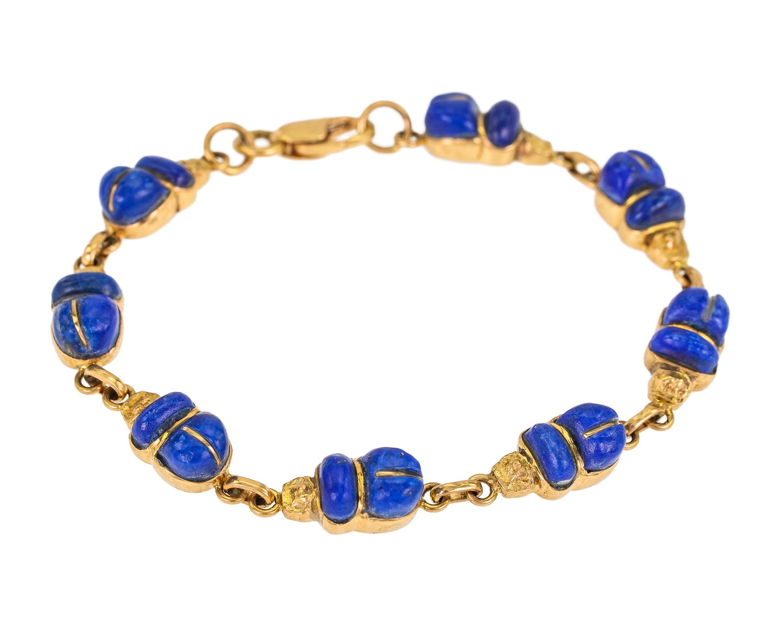 14k Bug Shaped Lapis Bracelet: 14k yellow gold bracelet with 8 links set with lapis in a bug shape. 15 grams t.w. 7" long.