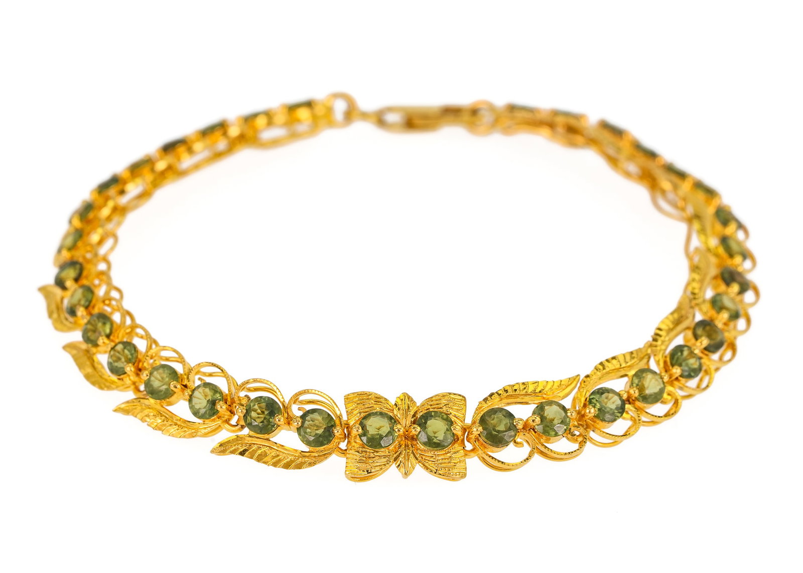 22K Green Sapphire Tennis Bracelet: 22k yellow gold bracelet set with 34 round cut .1 CT each Thai green sapphires. 3.4 CTS.T.W. 7 3/8" long. 13.2 grams t.w, marked 22k.