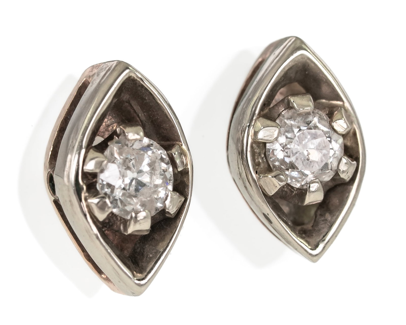 14k 1/2 CT Diamond Earrings: 14k yellow gold earrings with white gold top in marquise shape with a center 1/4 ct round cut diamond. 3.2 grams t.w.