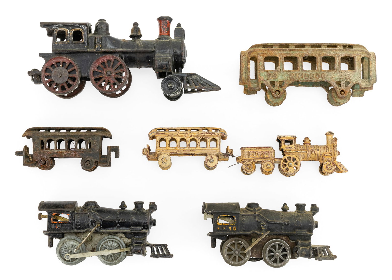 Vintage Cast Iron Floor Trains, Wind-ups: Vintage cast iron floor trains, wind-ups (7 pcs), including steam engine with good paint, two spring wind locomotives both running (one damaged), Ski Doo passenger car, etc, lengths 4" to 9"