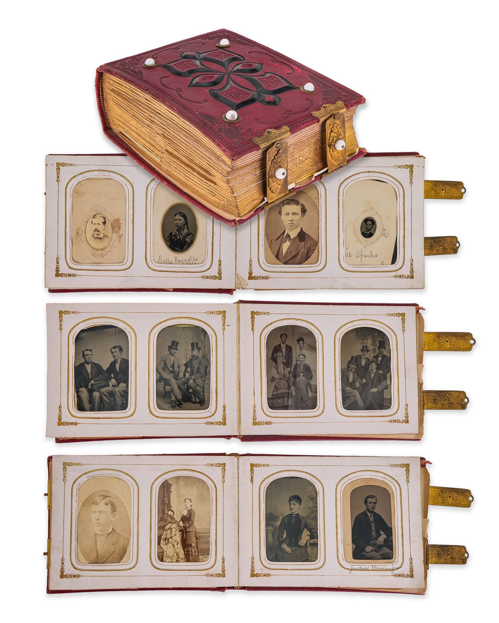 Victorian Photo Album: Victorian embossed red leather photo album with gilt clasps, black detail, and porcelain balls. Full album of tintypes and CDV's. Groups, identified people, many Reynolds-. 7" x 5" x 4" deep.