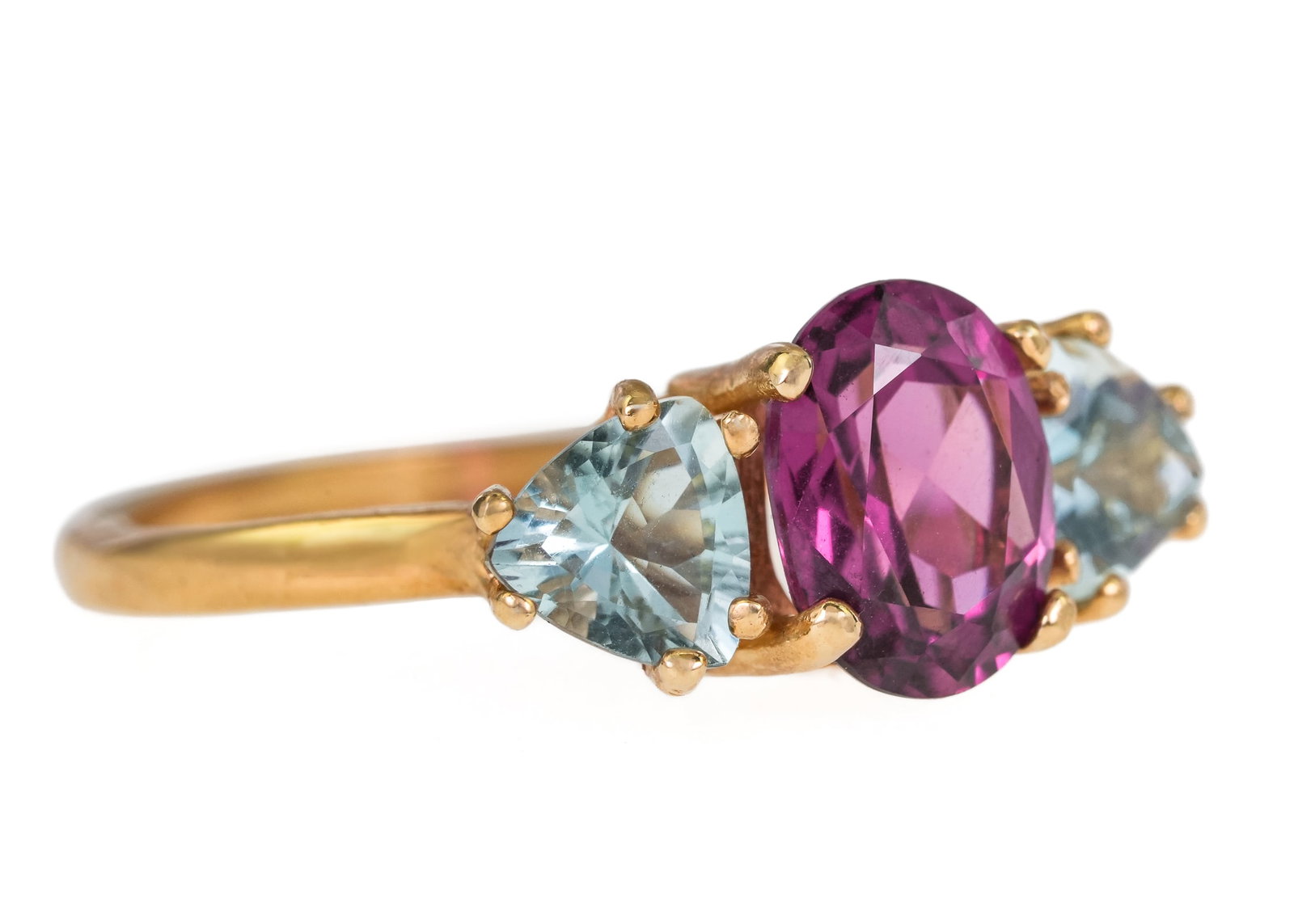 14k Rhodolite & Aquamarine 3 Stone Ring: 14k yellow gold ring with center oval cut 1.5 CT rhodolite with 2 triangular cut .35 ct aquamarines. Ring size 6