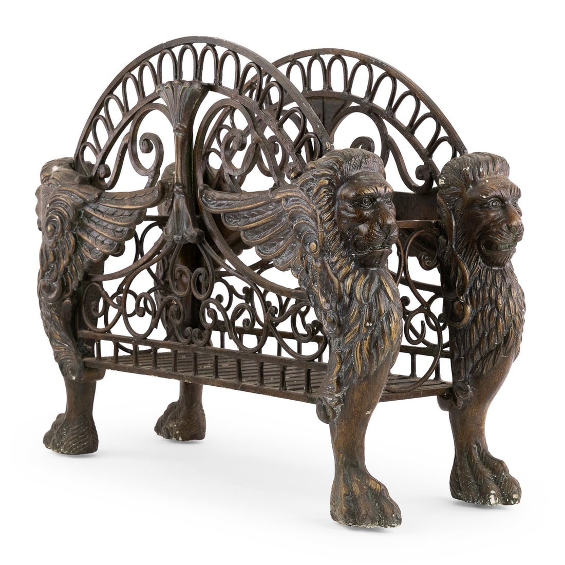 French Empire Style Firewood Holder: Late 20th c French Empire style bronze finish firewood holder with scrolled design and winged lion supports, 27" x 11" x 22"